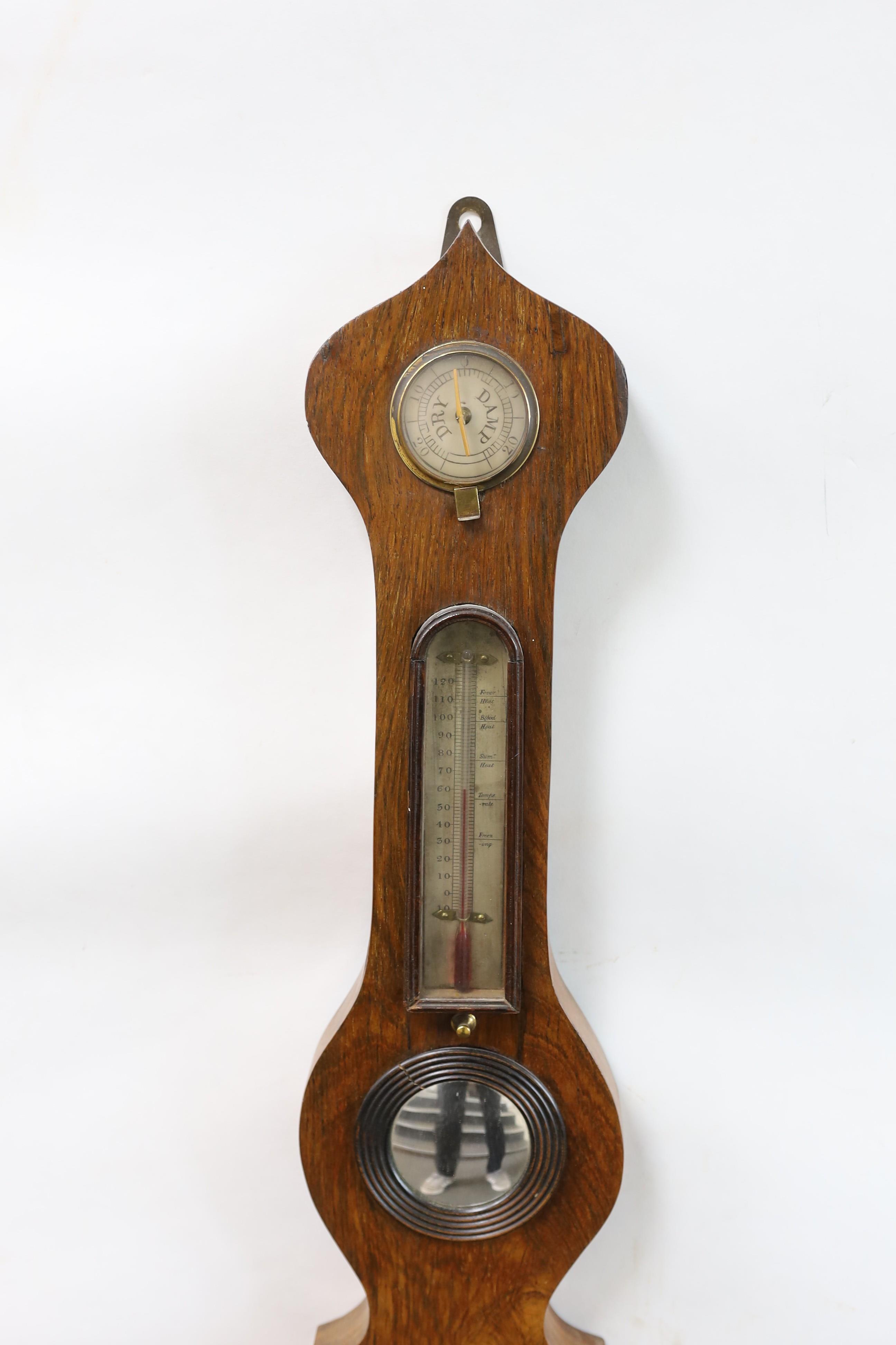 A Victorian rosewood wheel barometer and thermometer, with engraved silvered dials, height 103cm